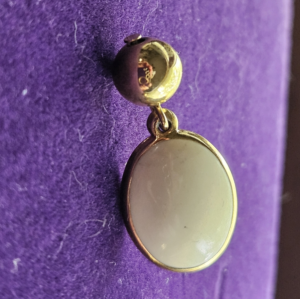 Gold tone earring with white stone and gold ball